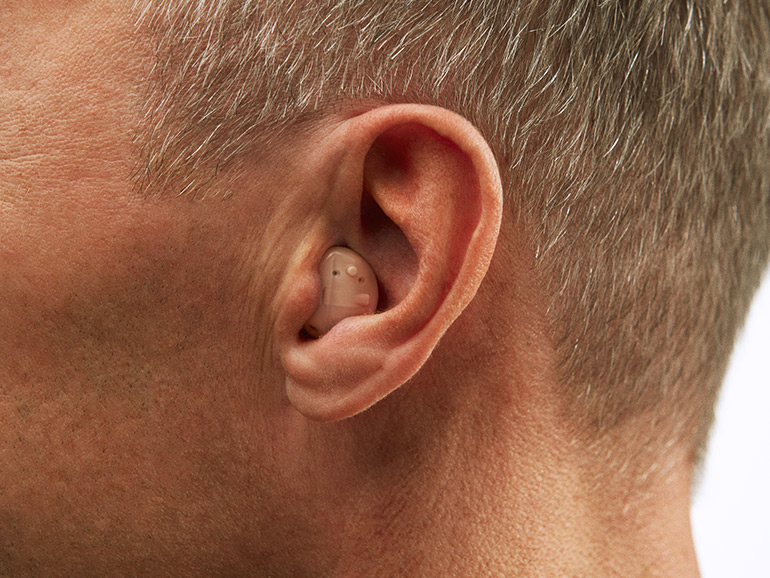 In the ear half shell hearing aid device